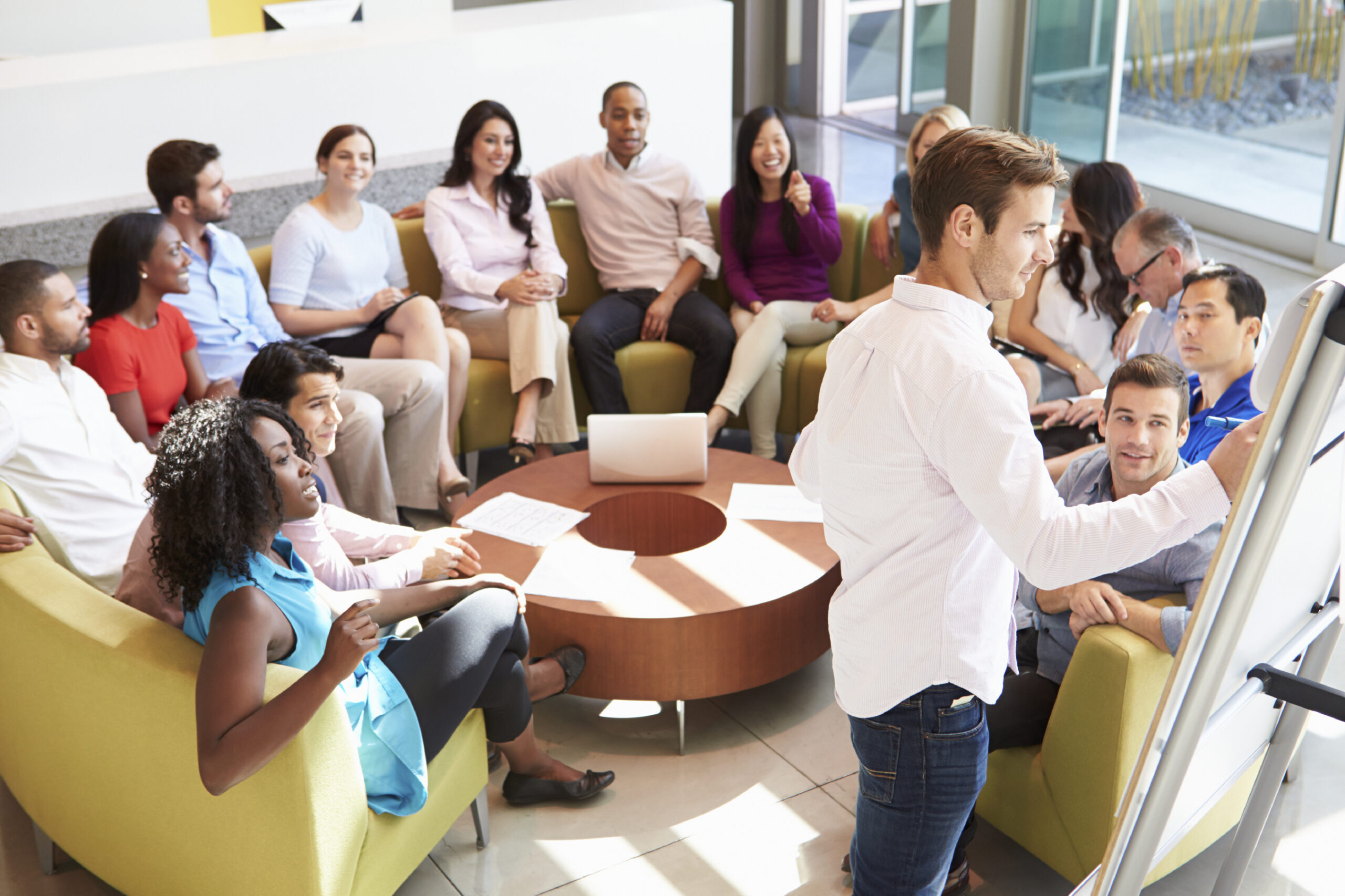 Businessman Making Presentation To Office Colleagues